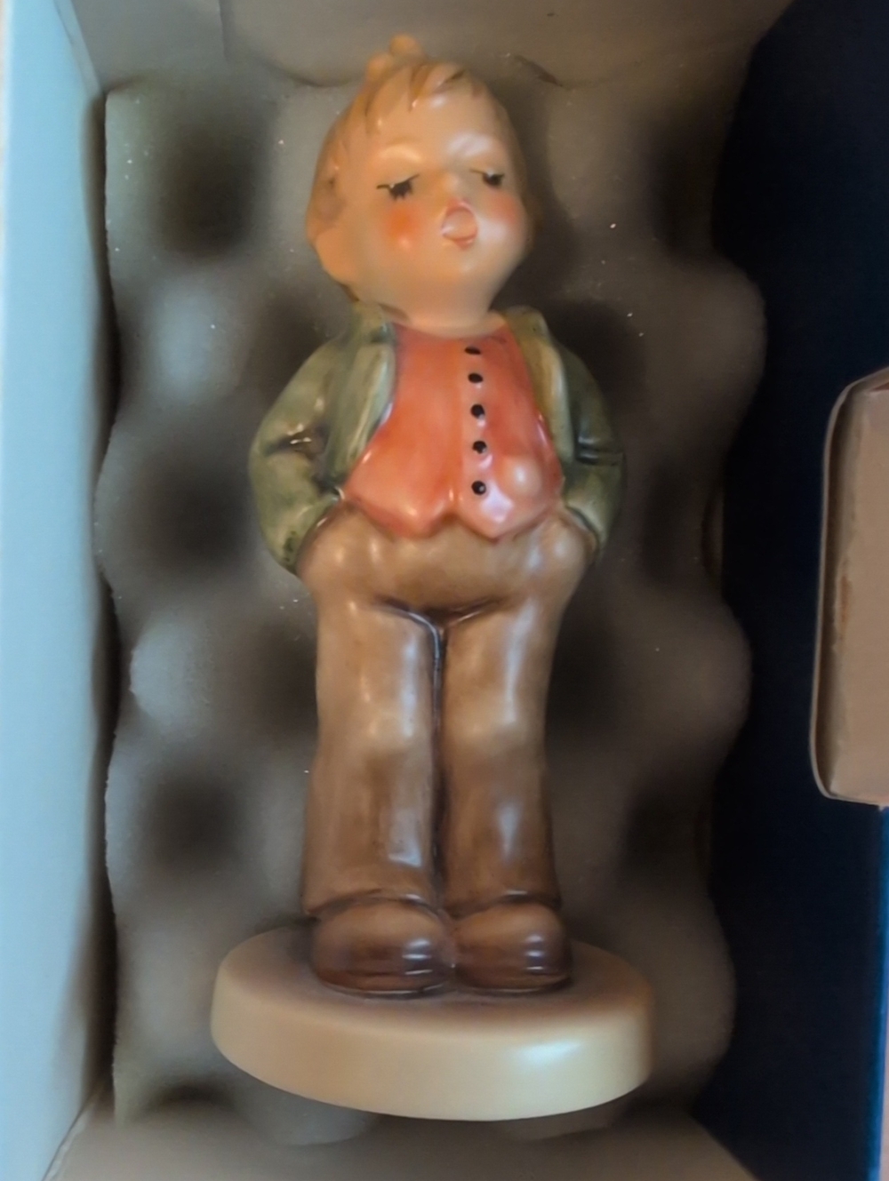 Hummel Hand-Painted Ceramic Boy Figurine in Cream, Brown, Green and Coral